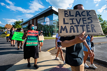 Students participate in a Black Lives Matter march on campus