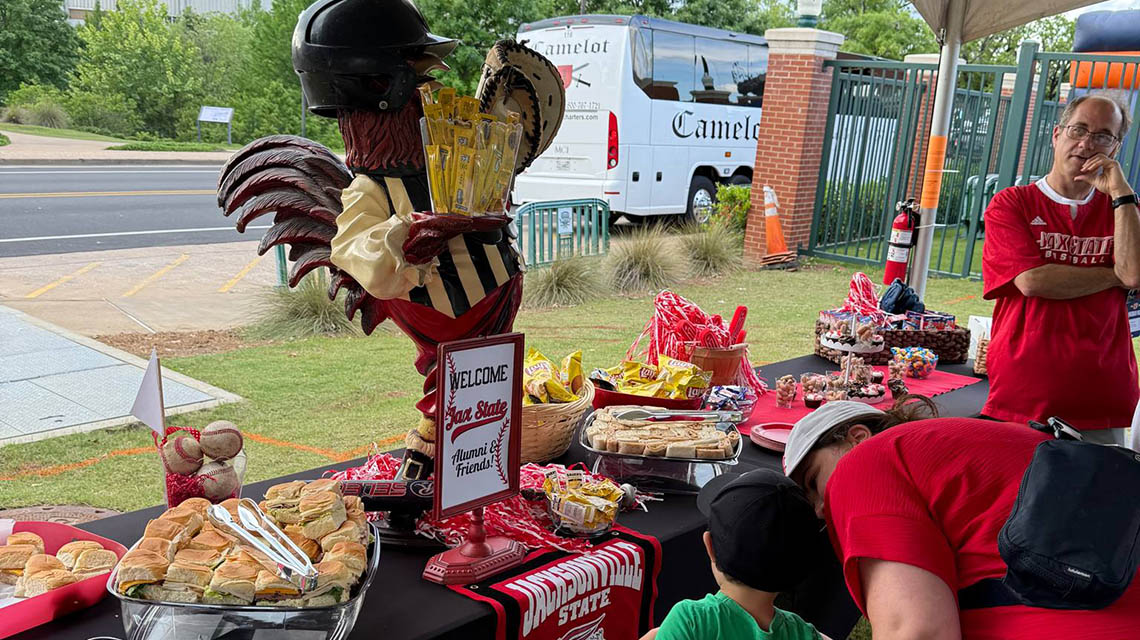 alumni sampling the snacks at the event