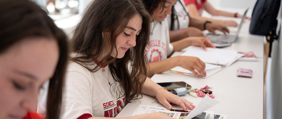 Students taking notes at a Financial Aid workshop