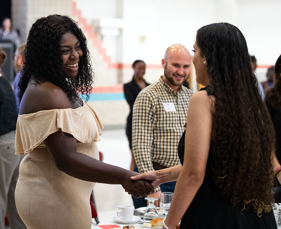 students shaking hands