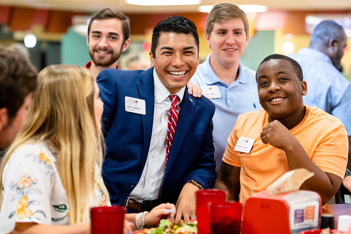 Ulises Herrera hanging out with students in the Caf